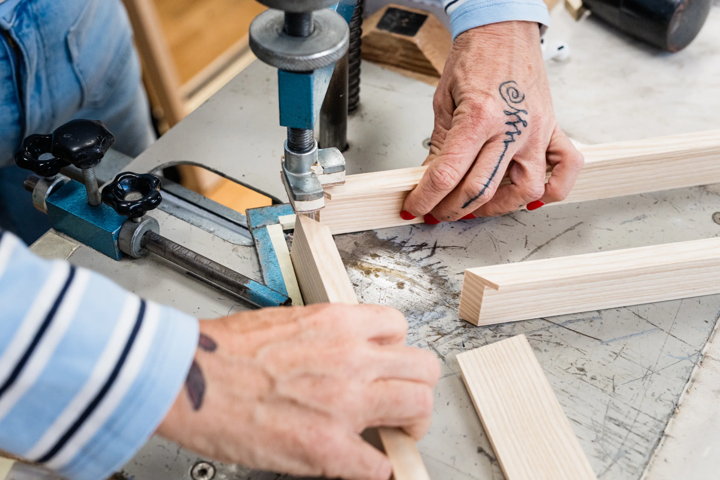A wooden frame being joined by hand